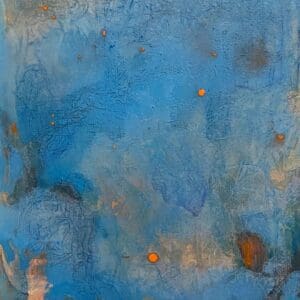 A blue painting with orange spots on it.